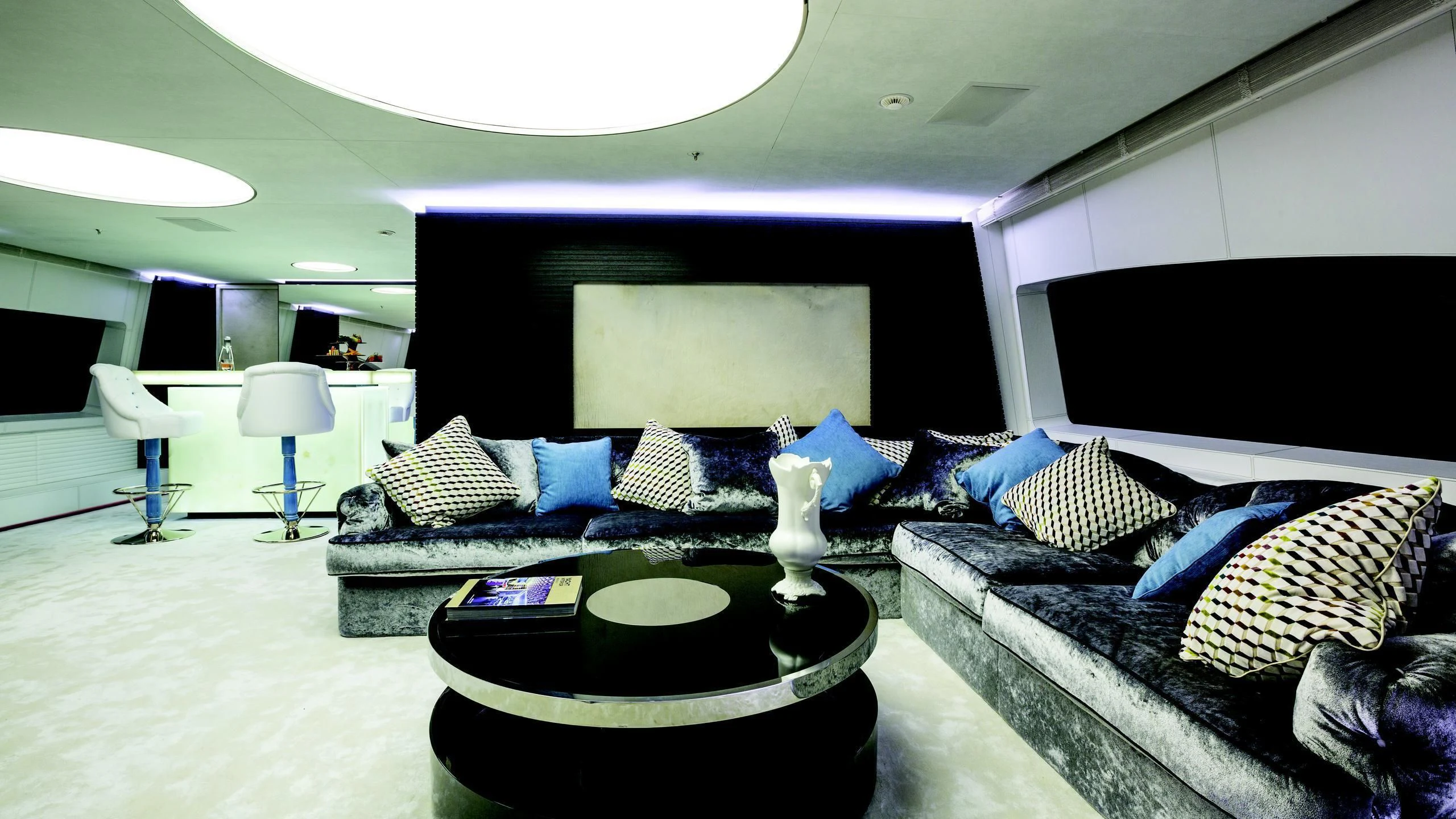 a living room with a couch and a table aboard OCEAN PARADISE Yacht for Sale