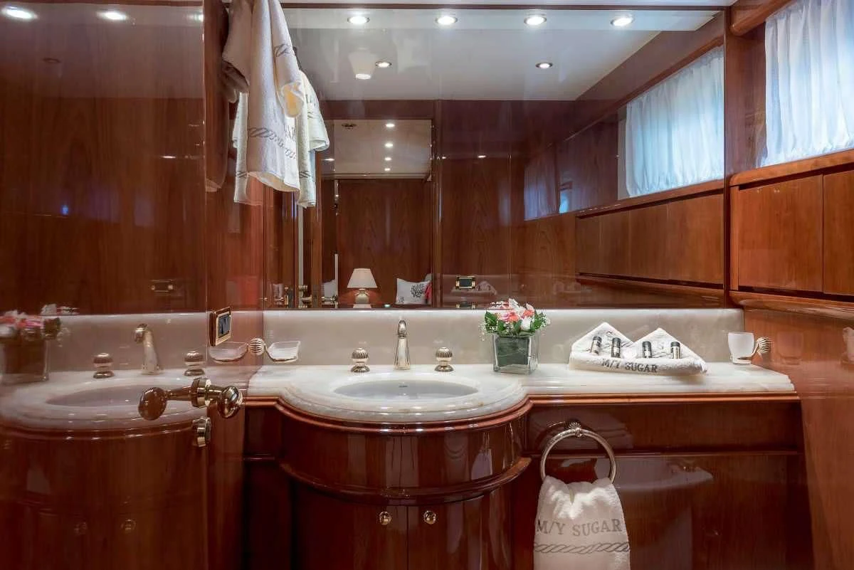 a bathroom with a large mirror aboard SUGAR Yacht for Sale