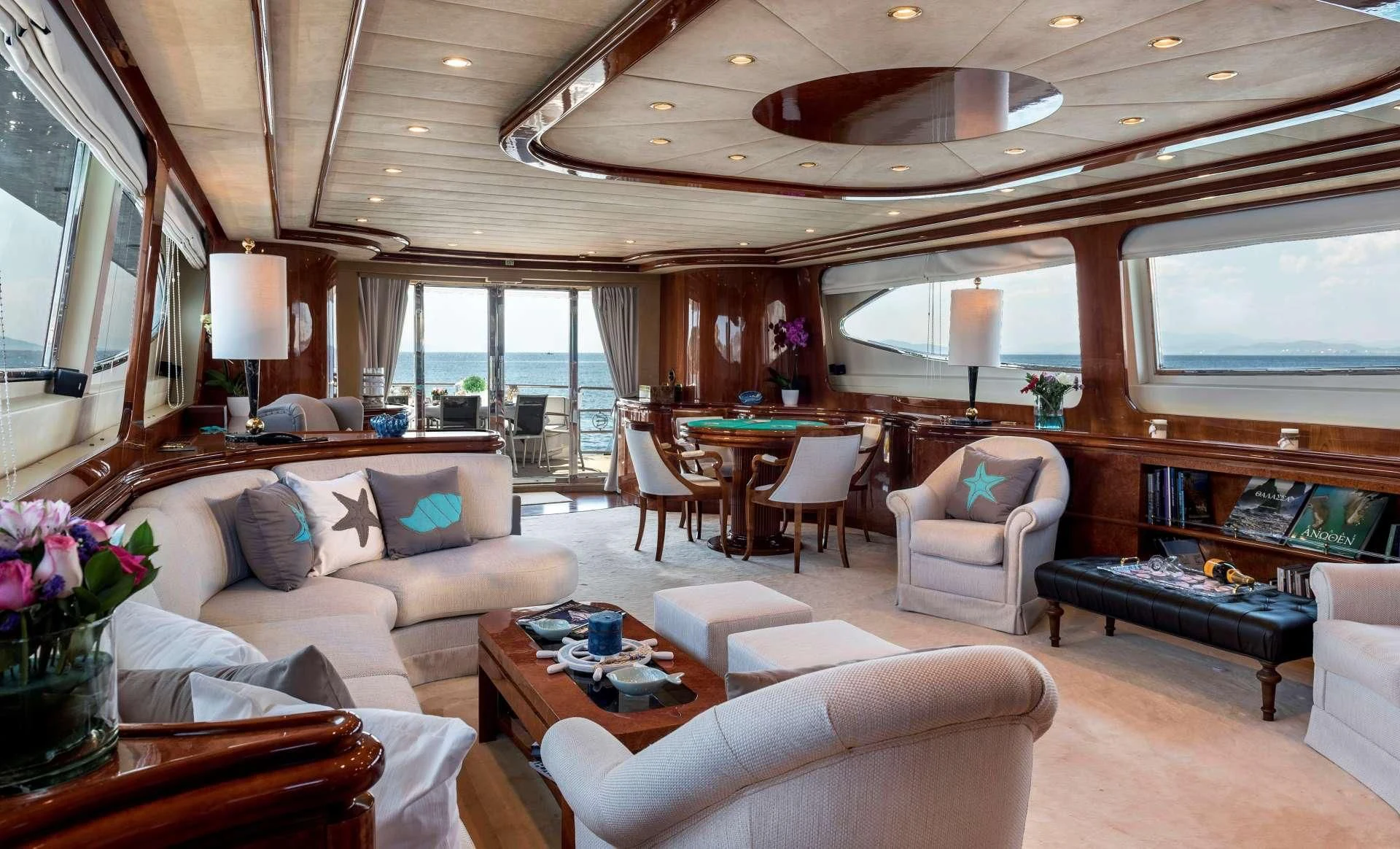 a living room with a large window aboard SUGAR Yacht for Sale