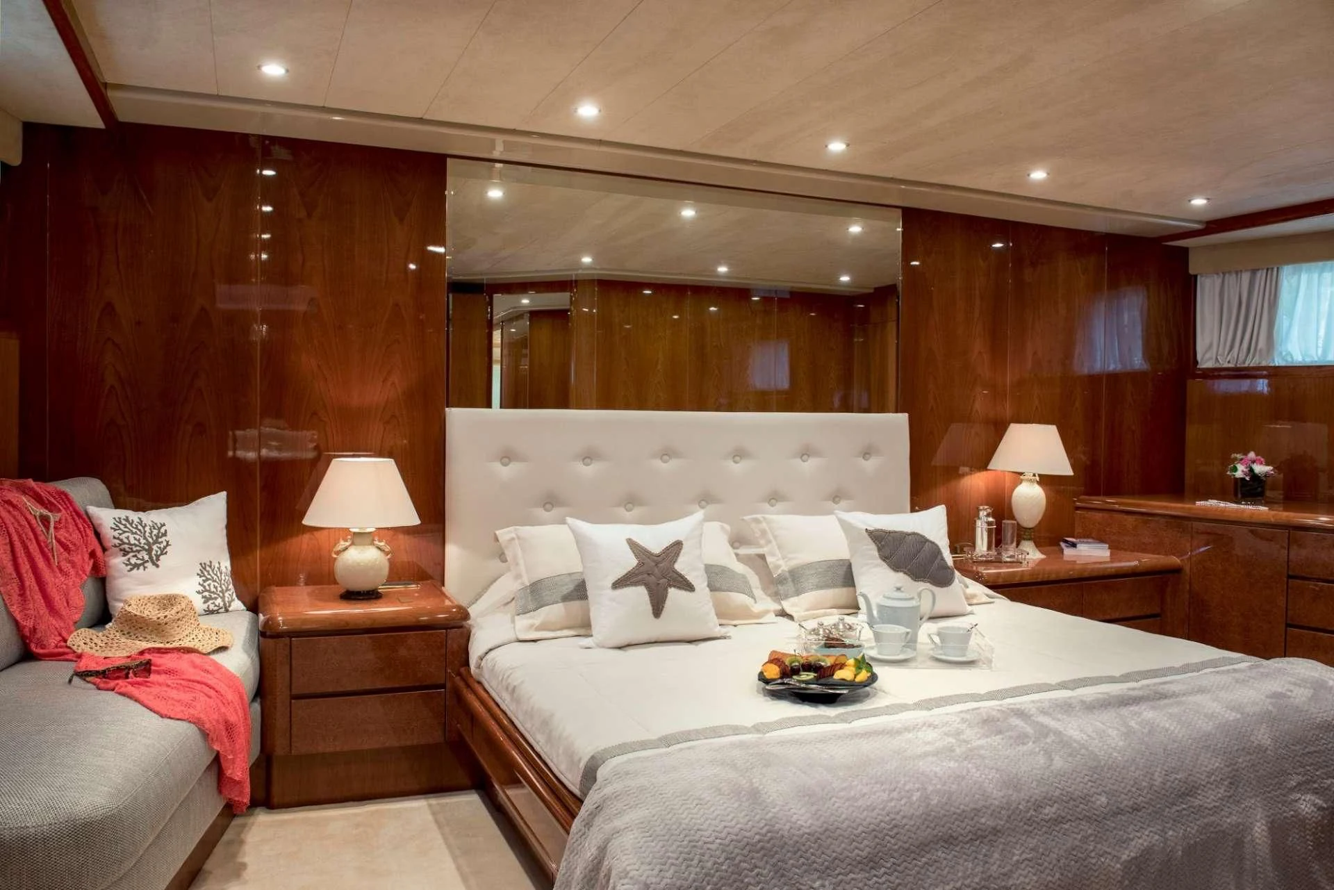 a room with a bed and a couch aboard SUGAR Yacht for Sale