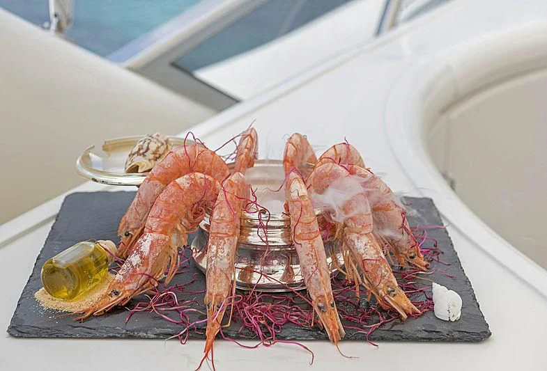 a plate of lobsters aboard SUGAR Yacht for Sale