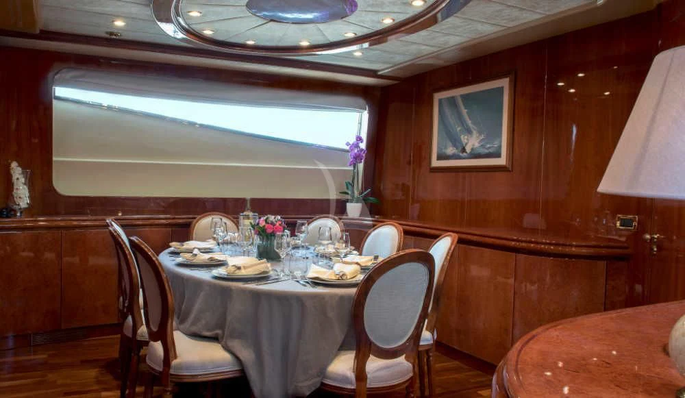 a dining table set for a meal aboard SUGAR Yacht for Sale