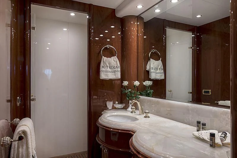 a bathroom with a large mirror aboard SUGAR Yacht for Sale