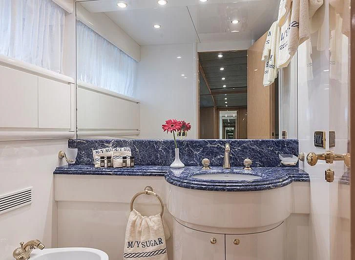 a bathroom with a large mirror aboard SUGAR Yacht for Sale
