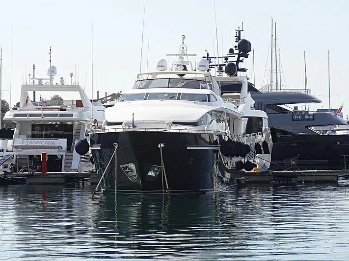 several boats are parked in a harbor aboard SUGAR Yacht for Sale