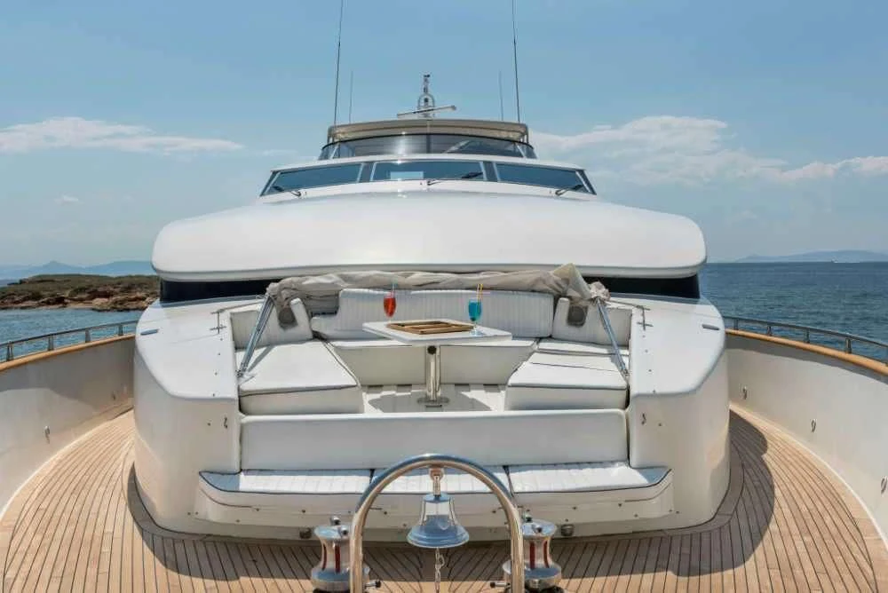 a white boat on a dock aboard SUGAR Yacht for Sale
