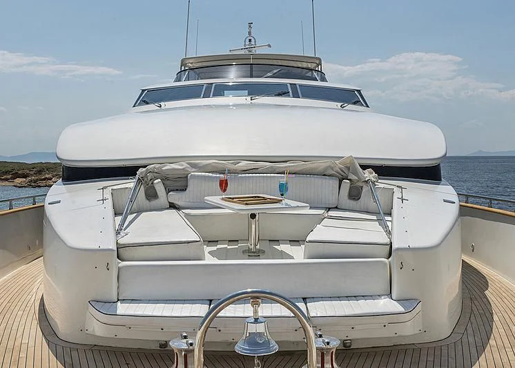a white yacht on a dock aboard SUGAR Yacht for Sale