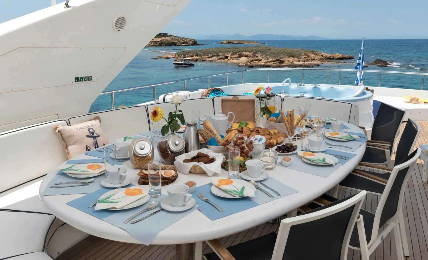 a table set for a meal on a boat aboard SUGAR Yacht for Sale
