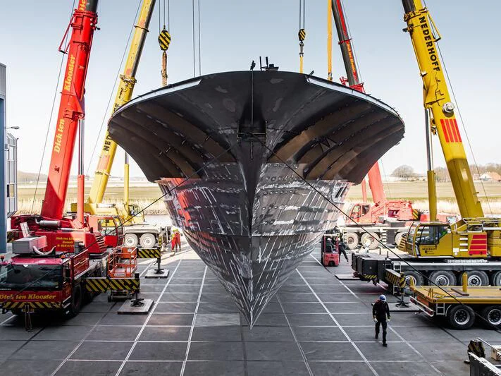 a large black ship in a dock aboard SPECIAL ONE Yacht for Sale