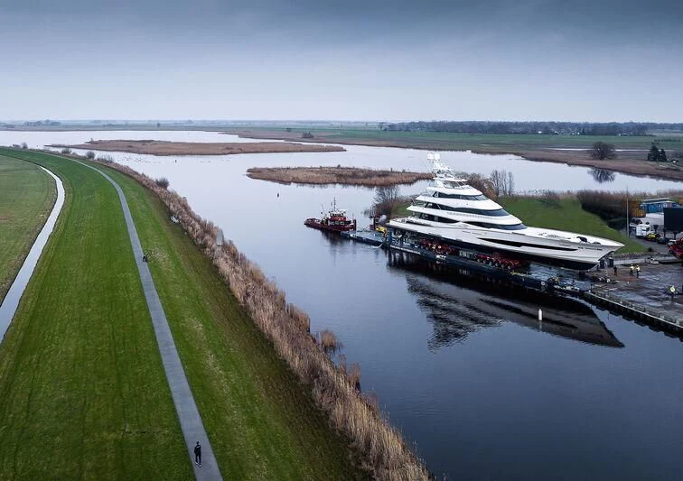 a river with boats and buildings along it aboard SPECIAL ONE Yacht for Sale