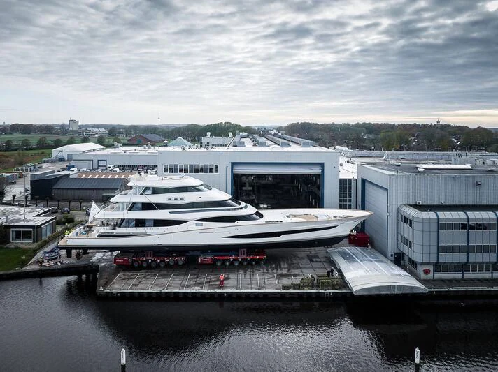 a large white boat in a harbor aboard SPECIAL ONE Yacht for Sale