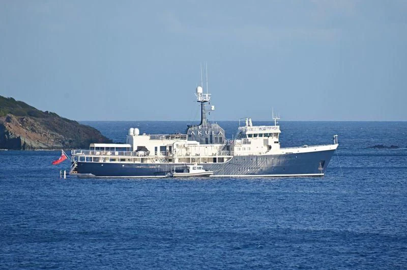 a large ship in the water aboard OMNIA Yacht for Sale