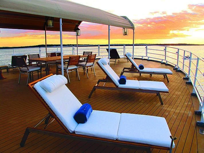 a lounge area on a boat aboard OMNIA Yacht for Sale