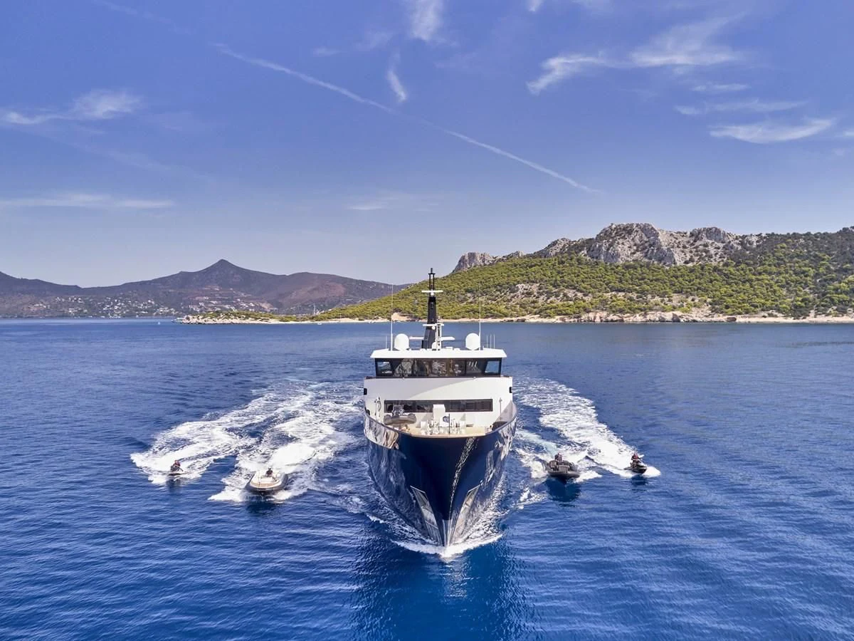 a boat traveling on water aboard OMNIA Yacht for Sale