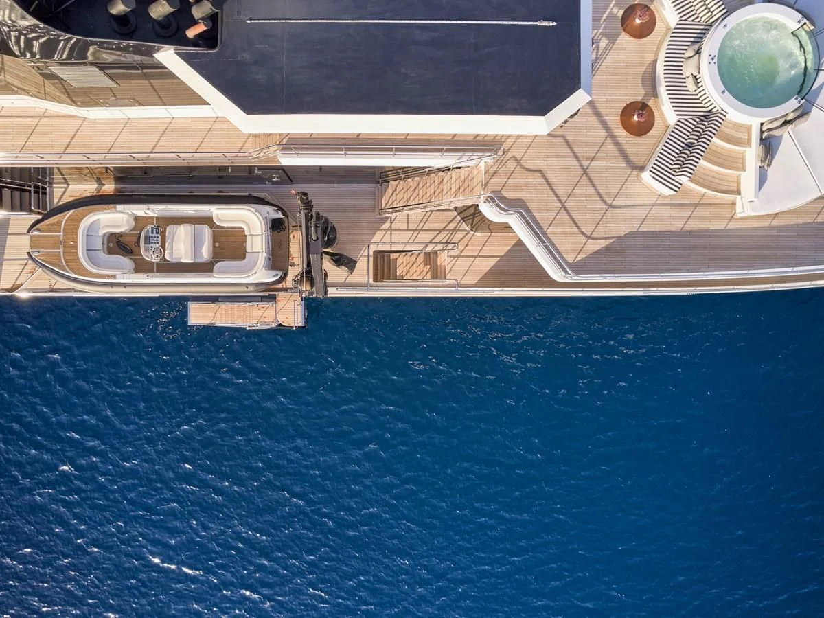 a building with a pool aboard OMNIA Yacht for Sale