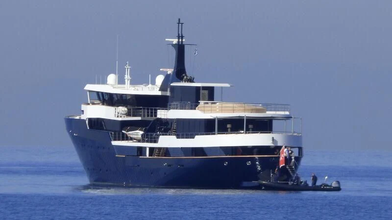 a large ship in the water aboard OMNIA Yacht for Sale
