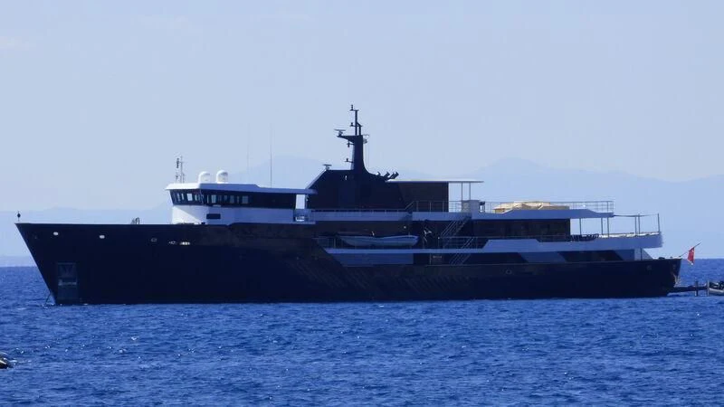 a large ship in the water aboard OMNIA Yacht for Sale