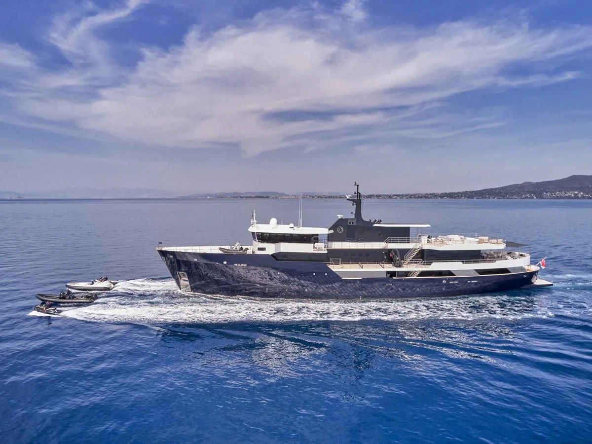 a large ship in the water aboard OMNIA Yacht for Sale