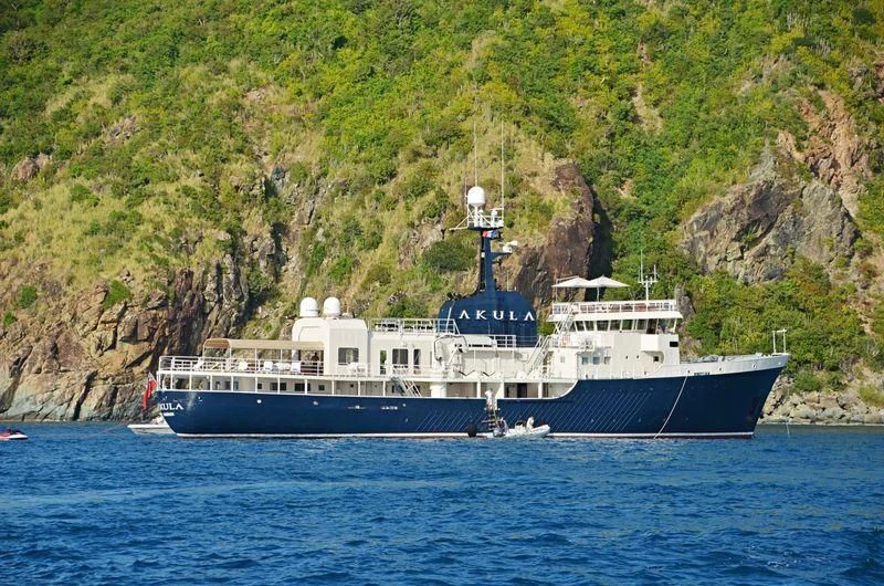 a large boat on the water aboard OMNIA Yacht for Sale