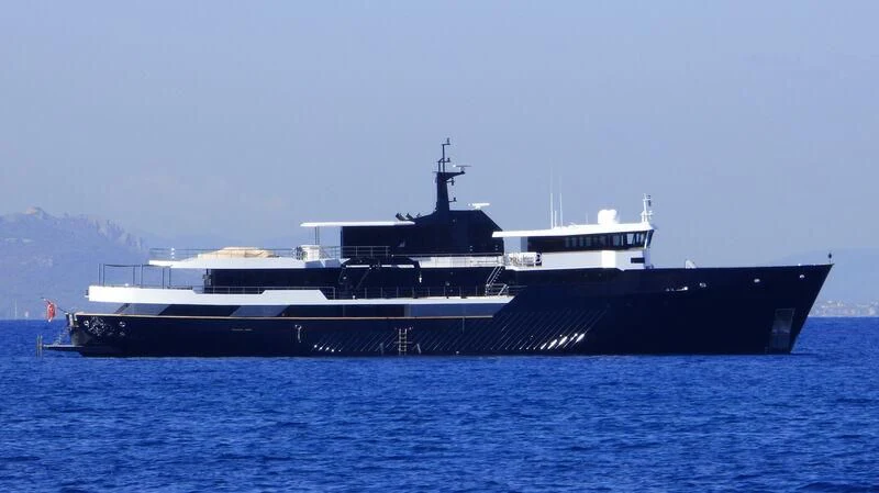 a large ship in the water aboard OMNIA Yacht for Sale