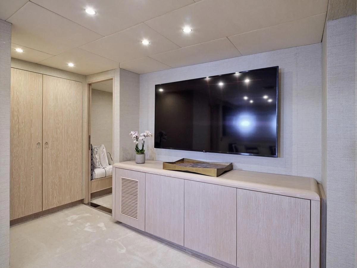 a room with a large tv aboard OMNIA Yacht for Sale
