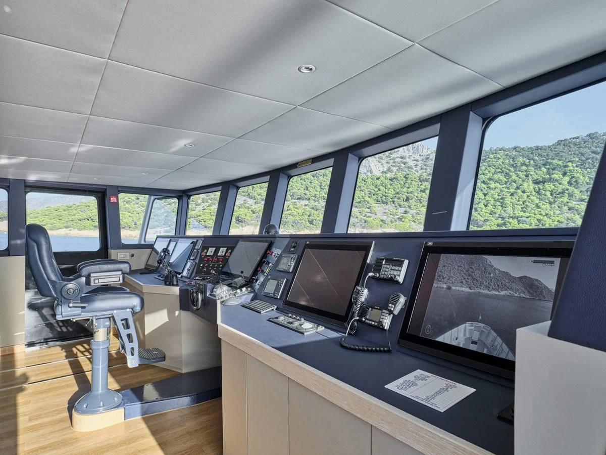 a room with computers and monitors aboard OMNIA Yacht for Sale