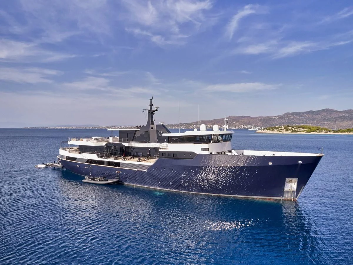 a large ship in the water aboard OMNIA Yacht for Sale