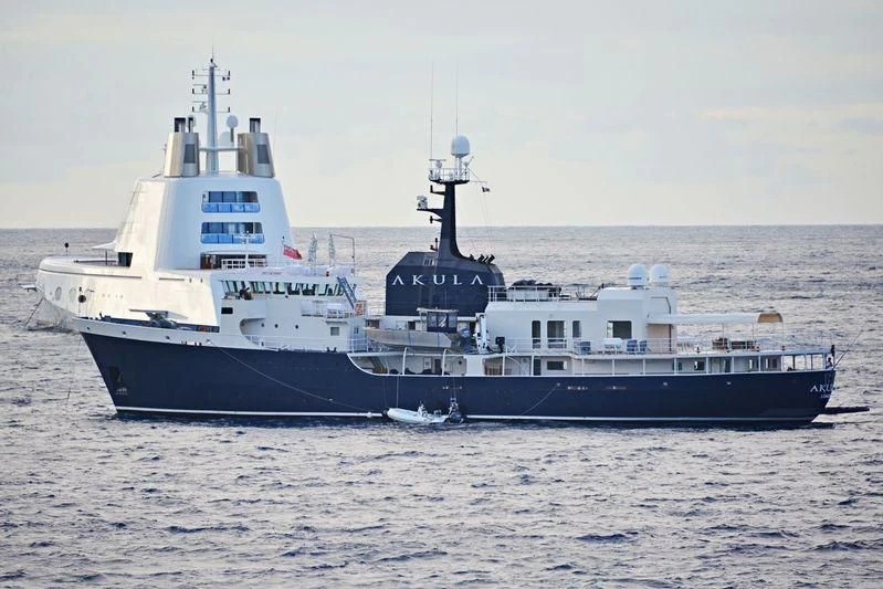 a couple of large boats in the water aboard OMNIA Yacht for Sale