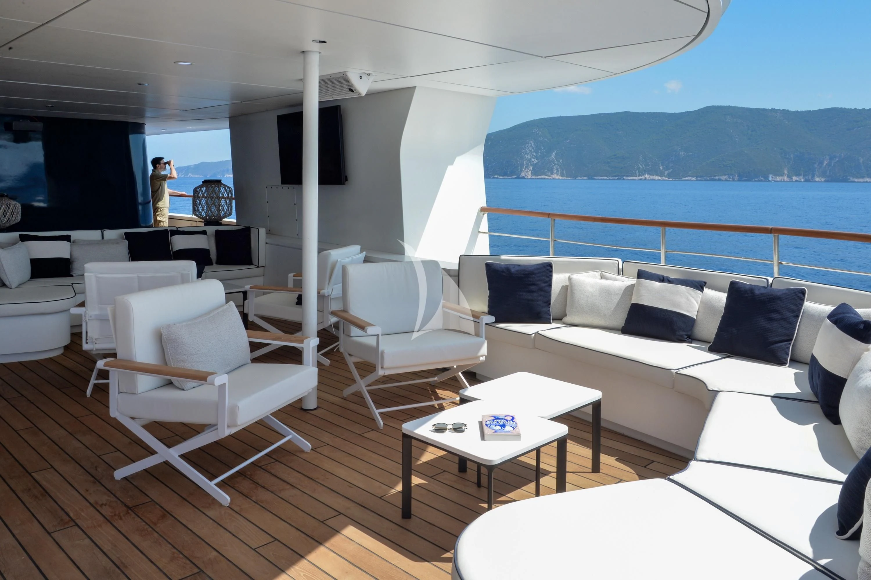 a living room with a large window aboard LE PONANT Yacht for Charter