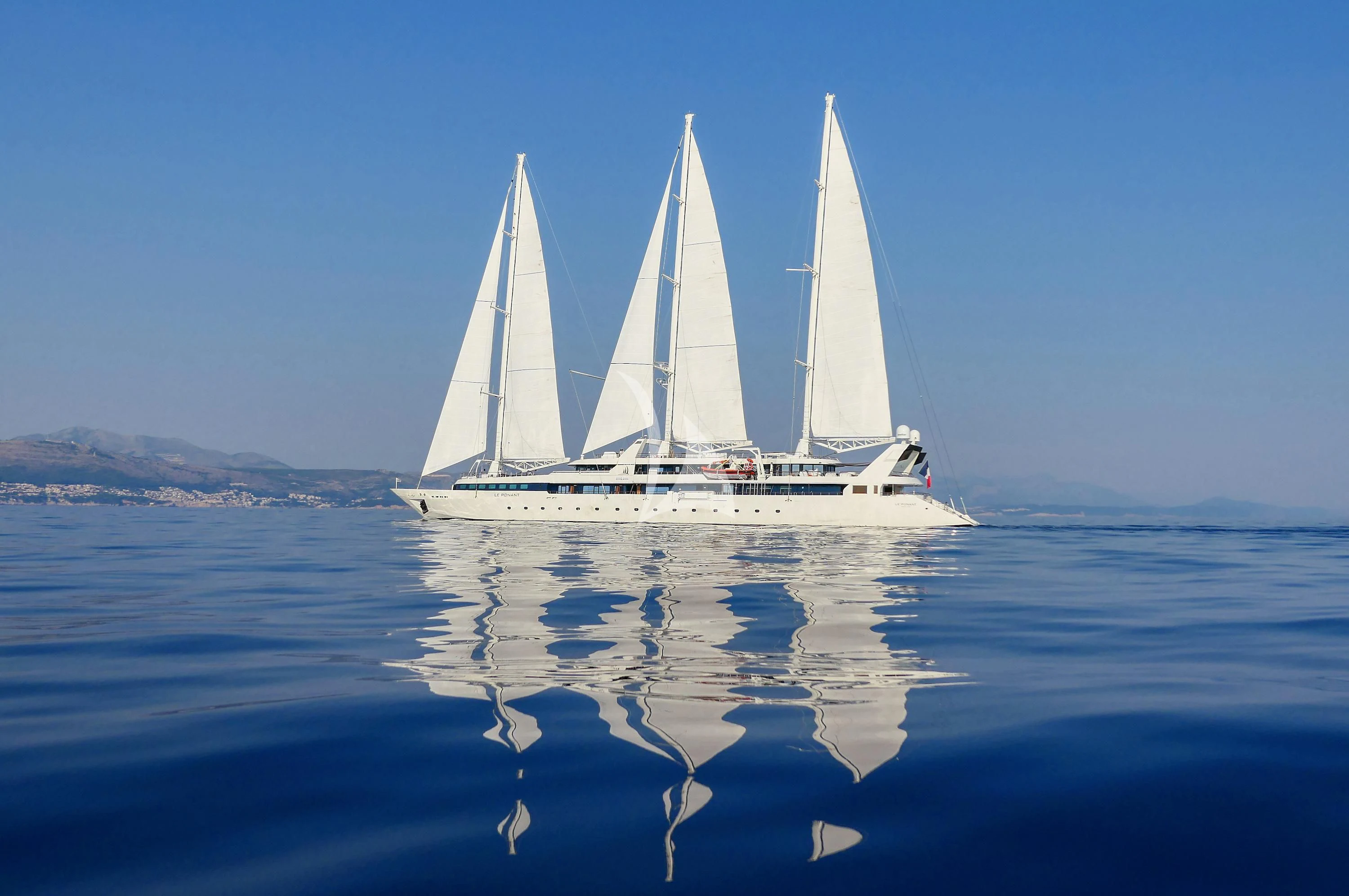 a sailboat on the water aboard LE PONANT Yacht for Charter