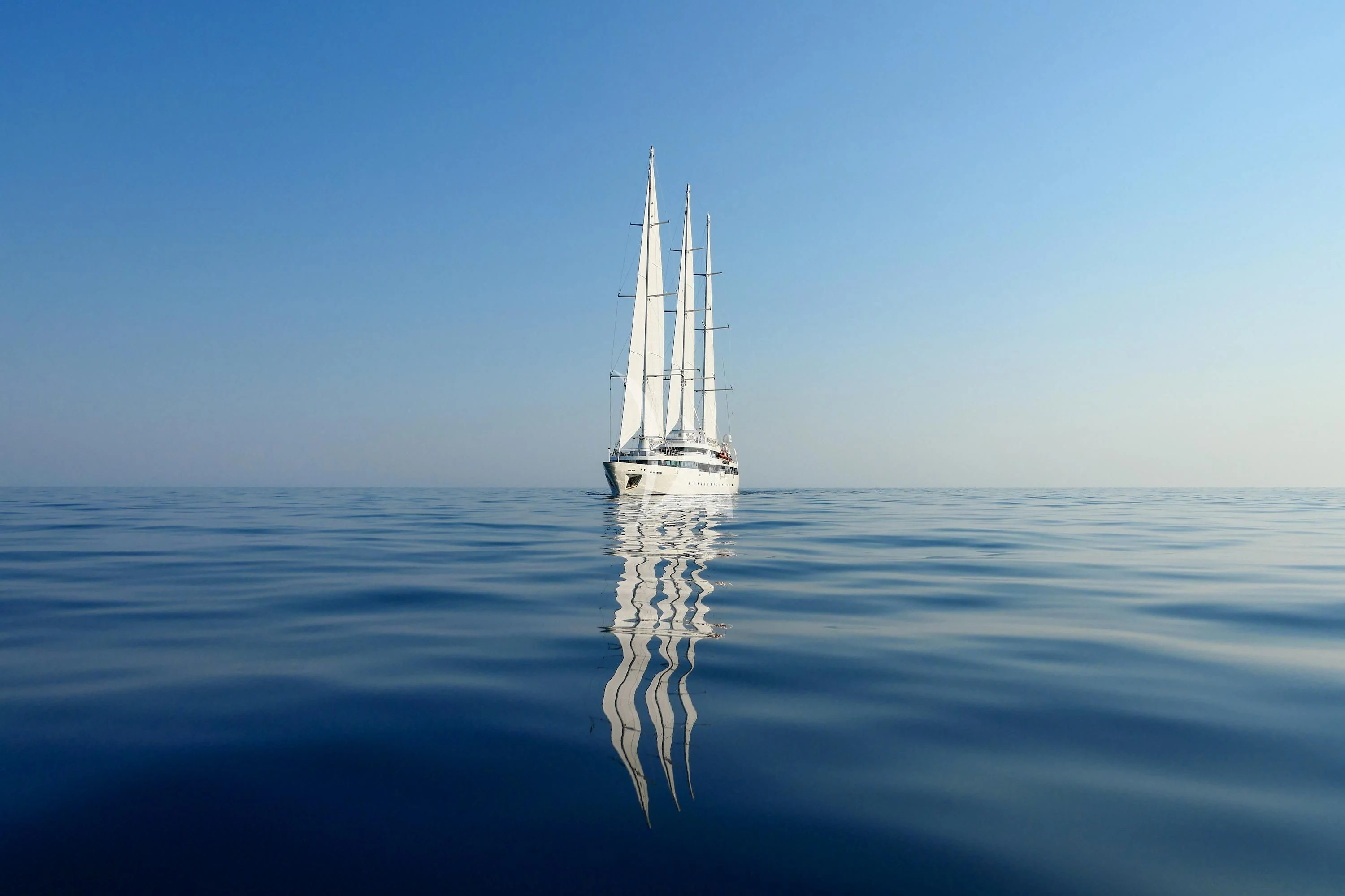 a sailboat in the water aboard LE PONANT Yacht for Charter