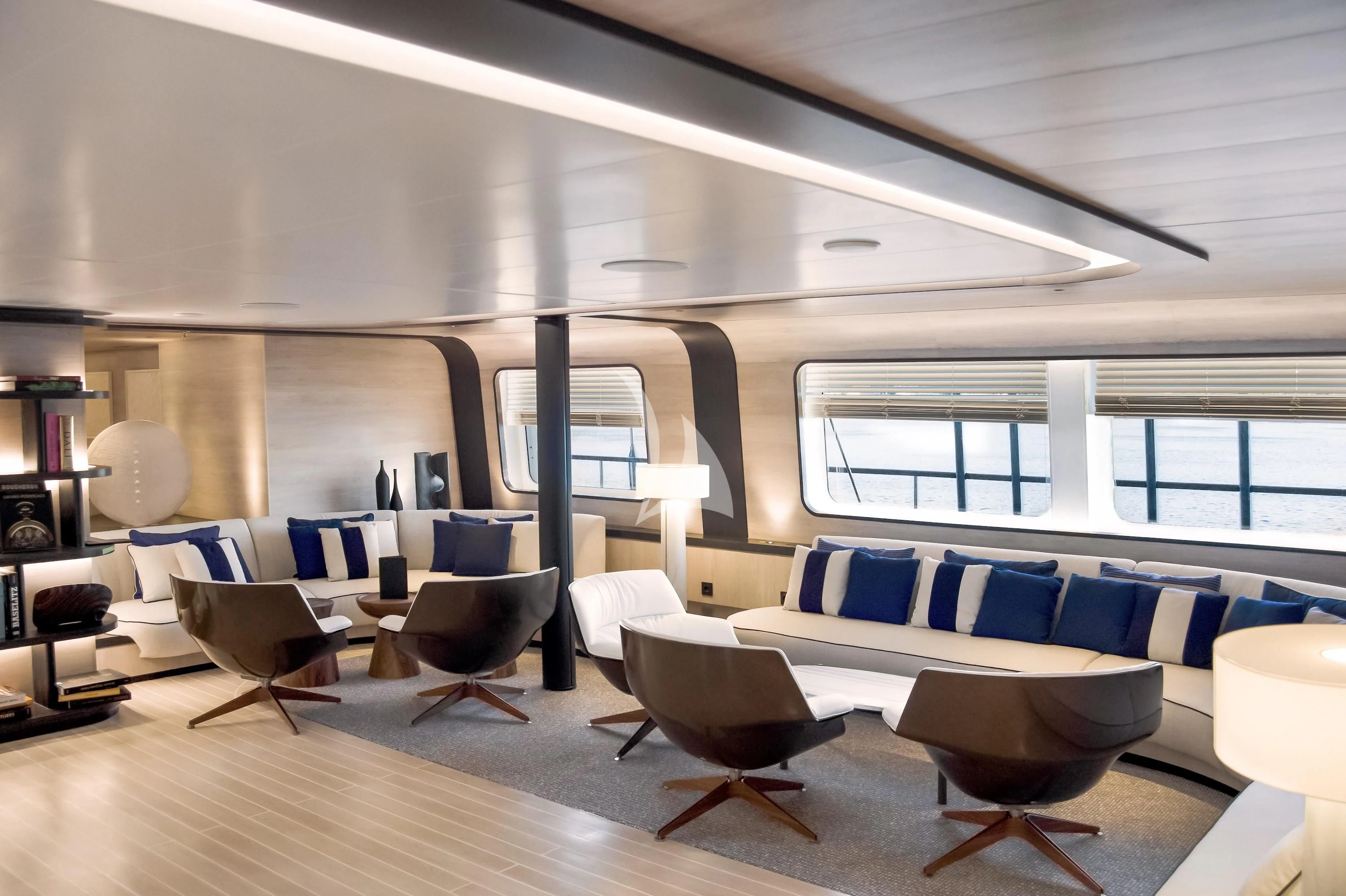 a room with chairs and tables aboard LE PONANT Yacht for Charter