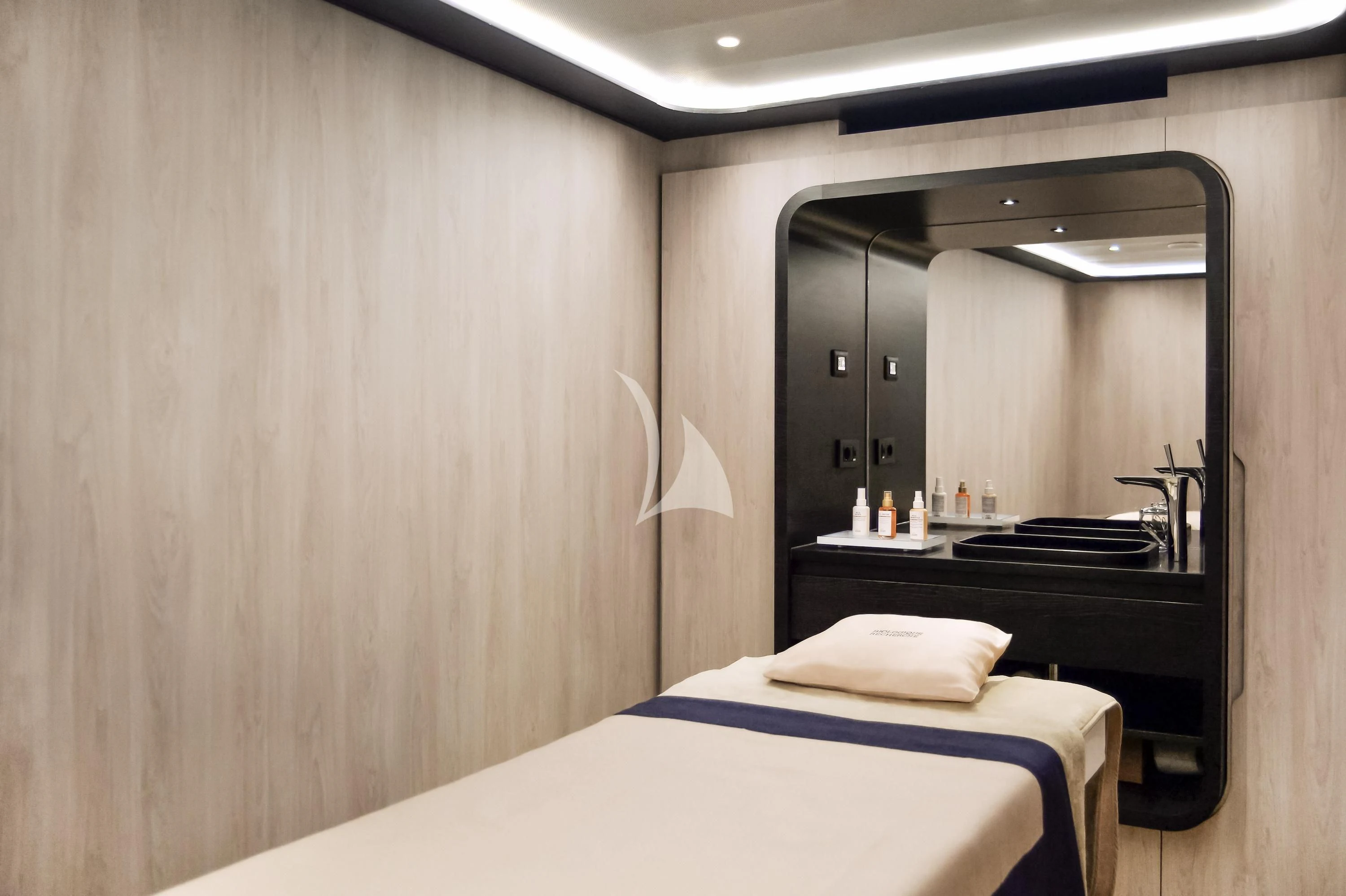 a hotel room with a bed aboard LE PONANT Yacht for Charter