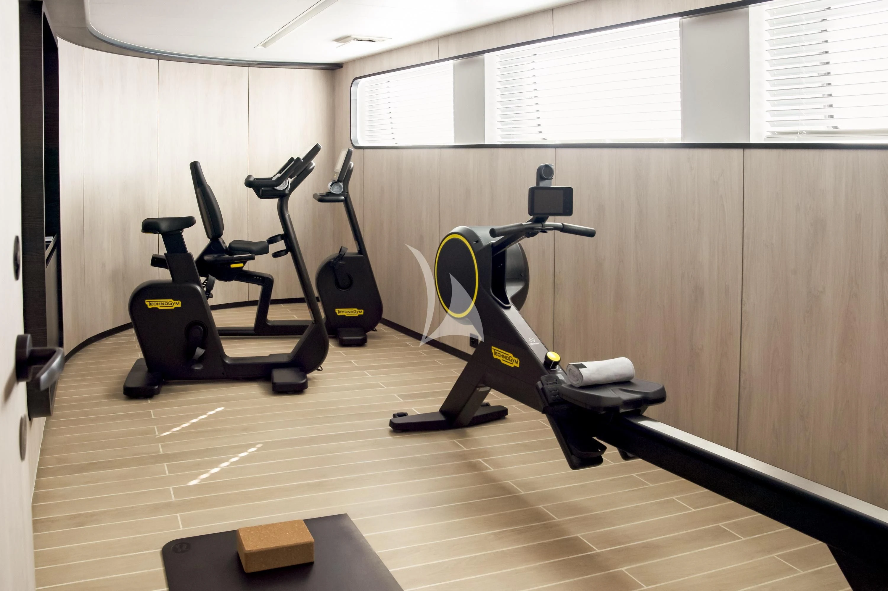 a gym with exercise equipment aboard LE PONANT Yacht for Charter