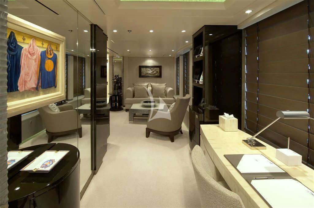 a room with a couch and a table and a television aboard HURRICANE RUN Yacht for Charter