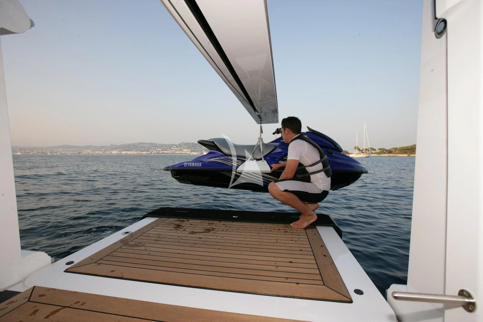 a man sitting on a boat aboard HURRICANE RUN Yacht for Charter