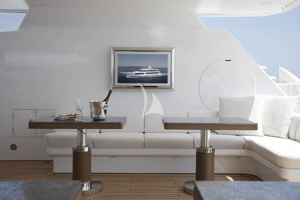 a living room with a white couch and a coffee table aboard HURRICANE RUN Yacht for Charter