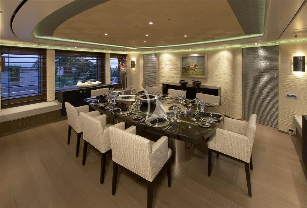 a large room with tables and chairs aboard HURRICANE RUN Yacht for Charter