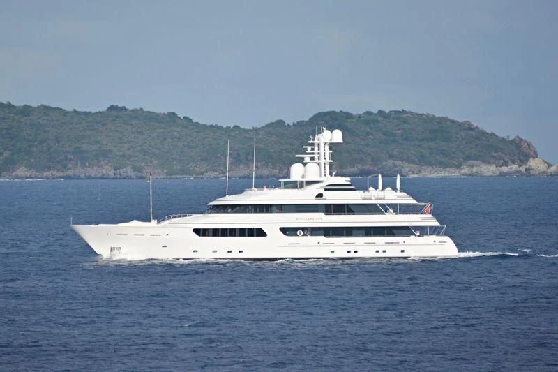 a large white boat in the water aboard HURRICANE RUN Yacht for Charter