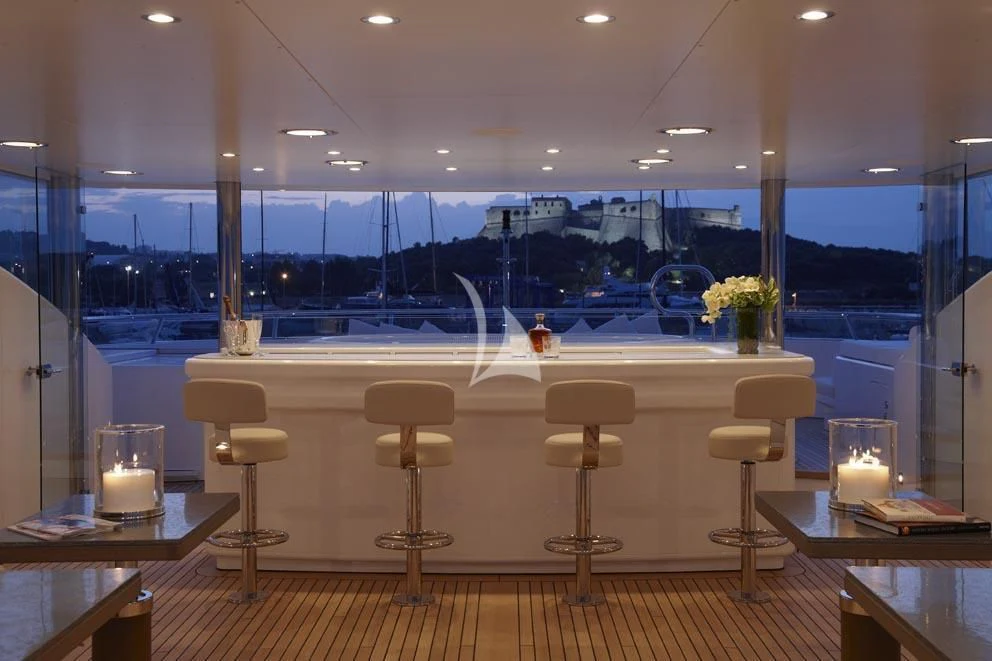 a room with a table and chairs aboard HURRICANE RUN Yacht for Charter