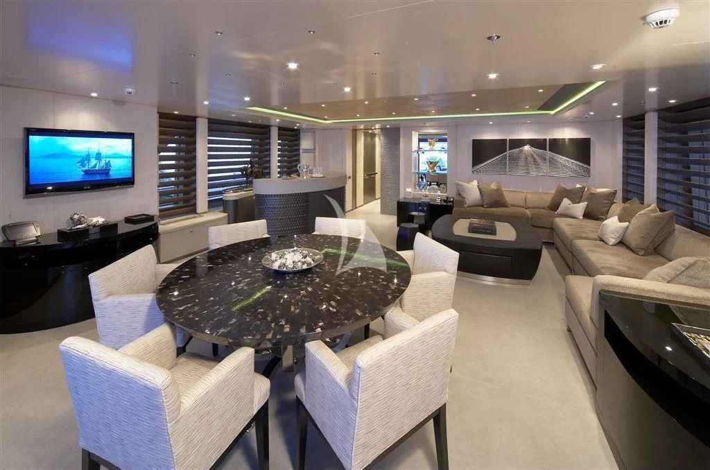 a living room with a large screen aboard HURRICANE RUN Yacht for Charter