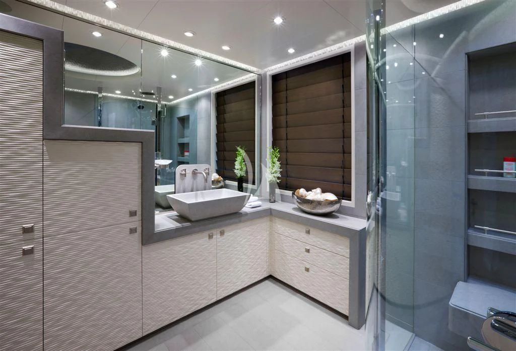 a bathroom with a glass shower aboard HURRICANE RUN Yacht for Charter