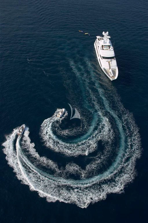 a high angle view of a ship with Kwajalein Atoll in the background aboard HURRICANE RUN Yacht for Charter