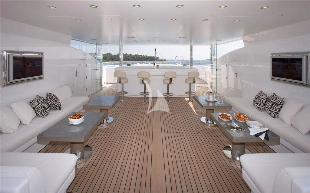 a living room with a large window aboard HURRICANE RUN Yacht for Charter