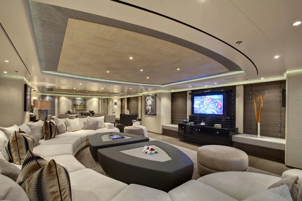 a living room with a large screen aboard HURRICANE RUN Yacht for Charter