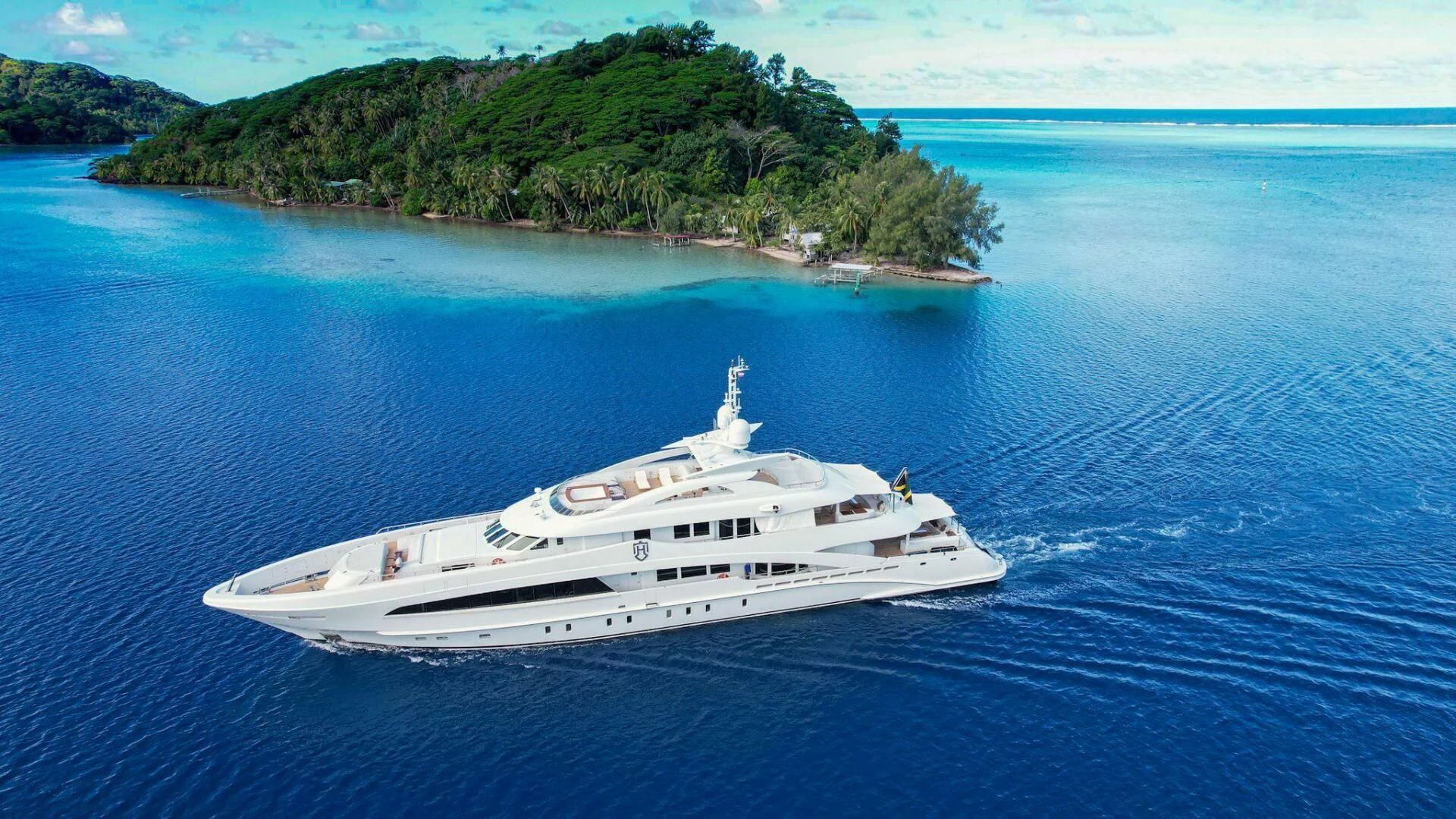 a white yacht in the water aboard KNIGHT Yacht for Charter