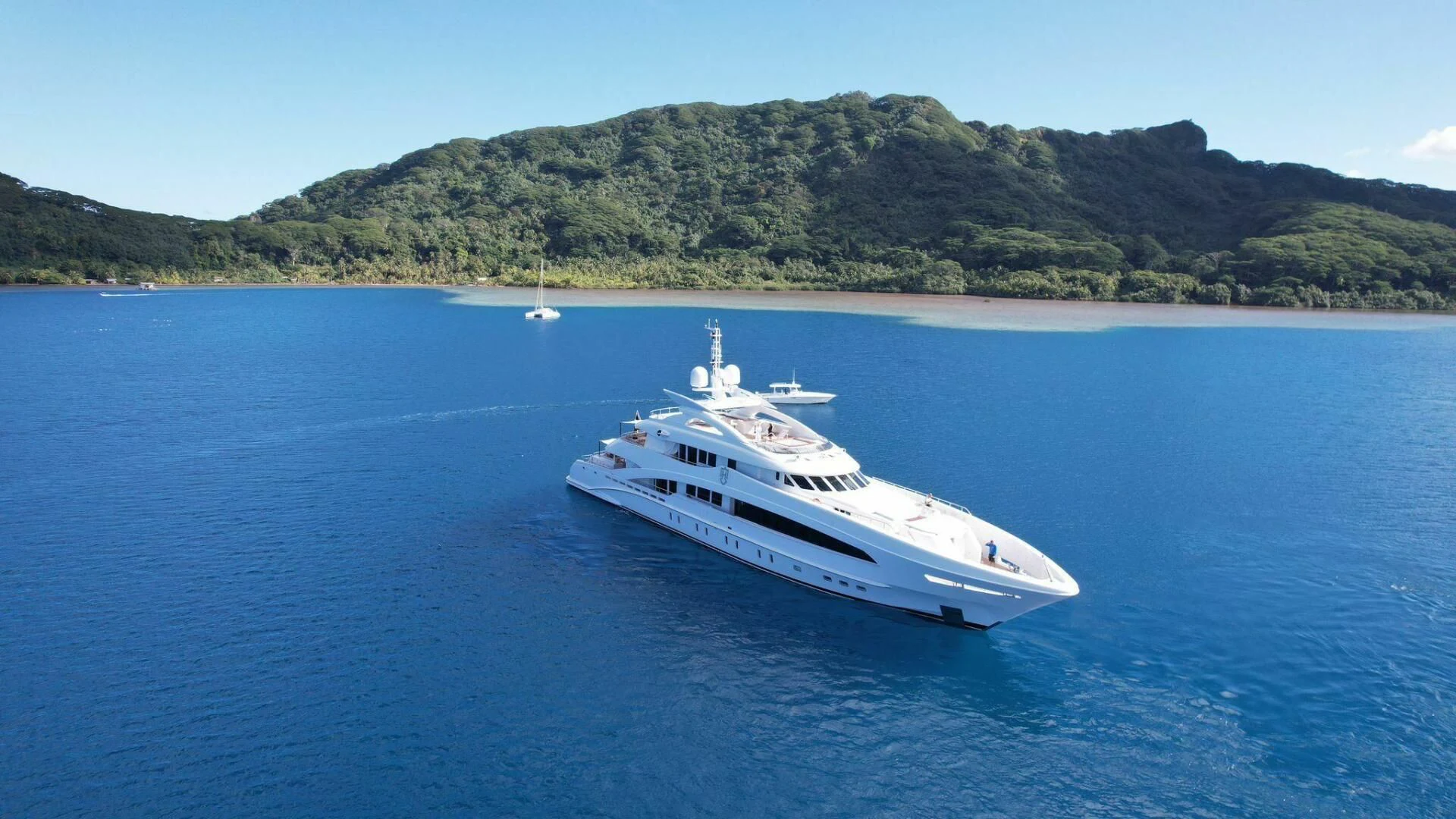 a white boat on the water aboard KNIGHT Yacht for Charter