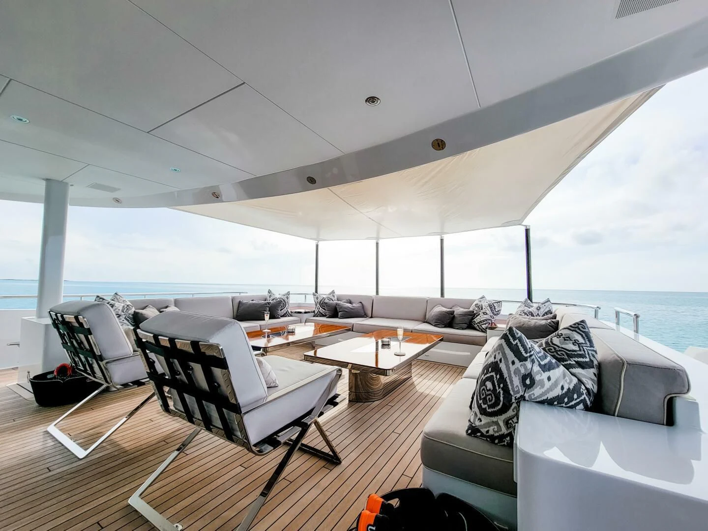 a living room with a large window aboard KNIGHT Yacht for Charter