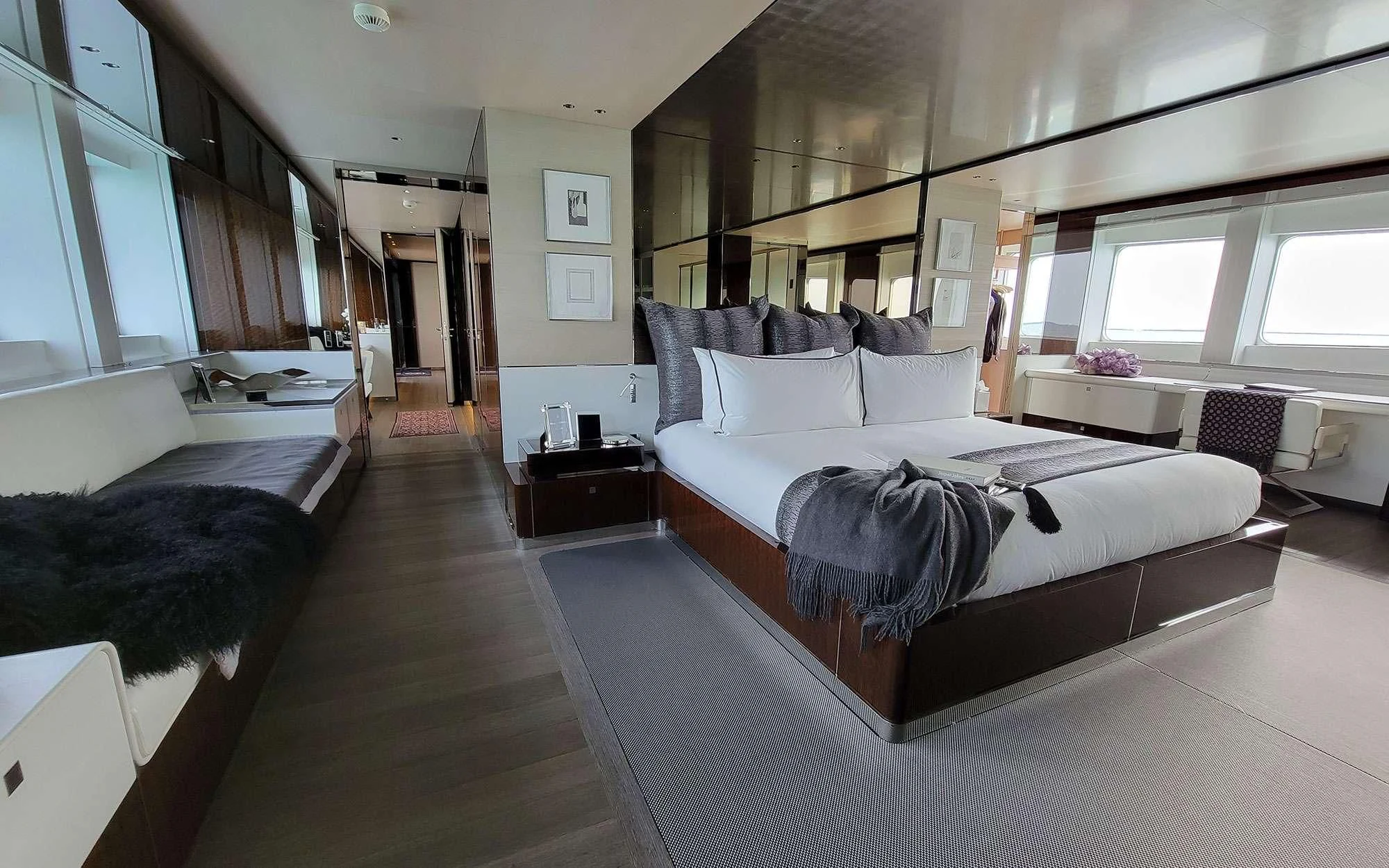 a room with a bed and a couch aboard KNIGHT Yacht for Charter