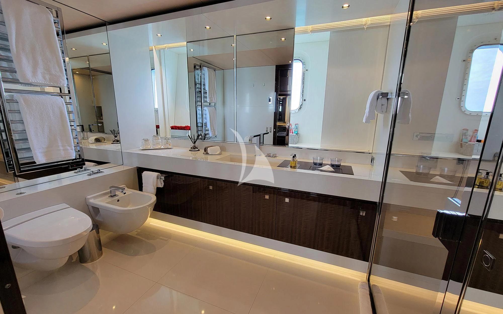 a bathroom with a large mirror aboard KNIGHT Yacht for Charter